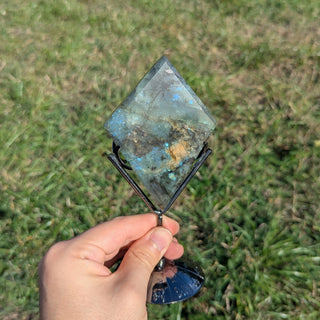 Labradorite crystal diamond on a display stand